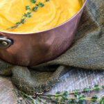 low histamine anti inflammatory ginger carrot soup in pot with garnish
