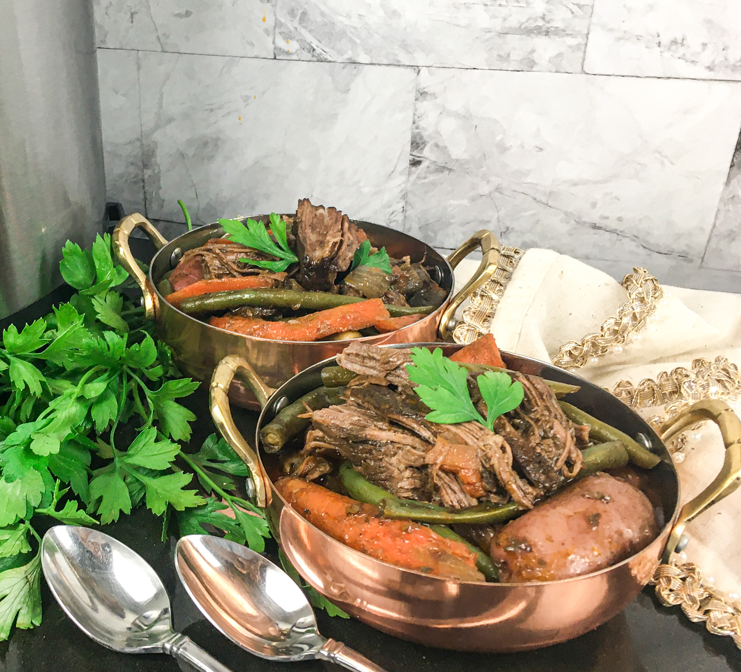 pot roast with sweet potatoes in large serving bowl topped with parsley garnish